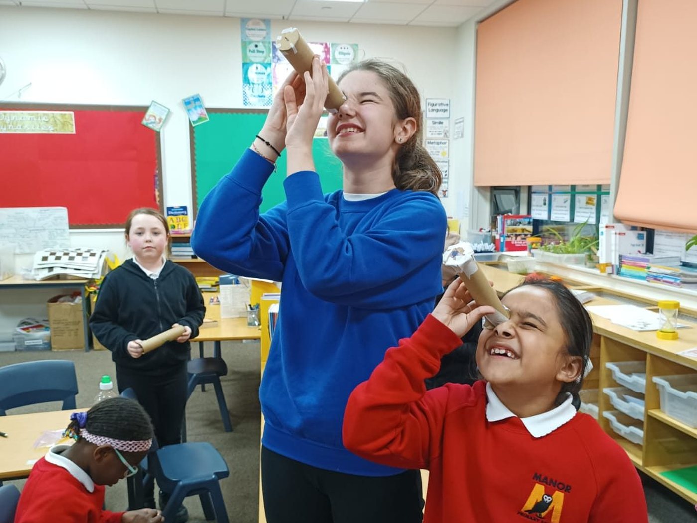 Blog A Mission Specialist demonstrating with mission hardware in a classroom